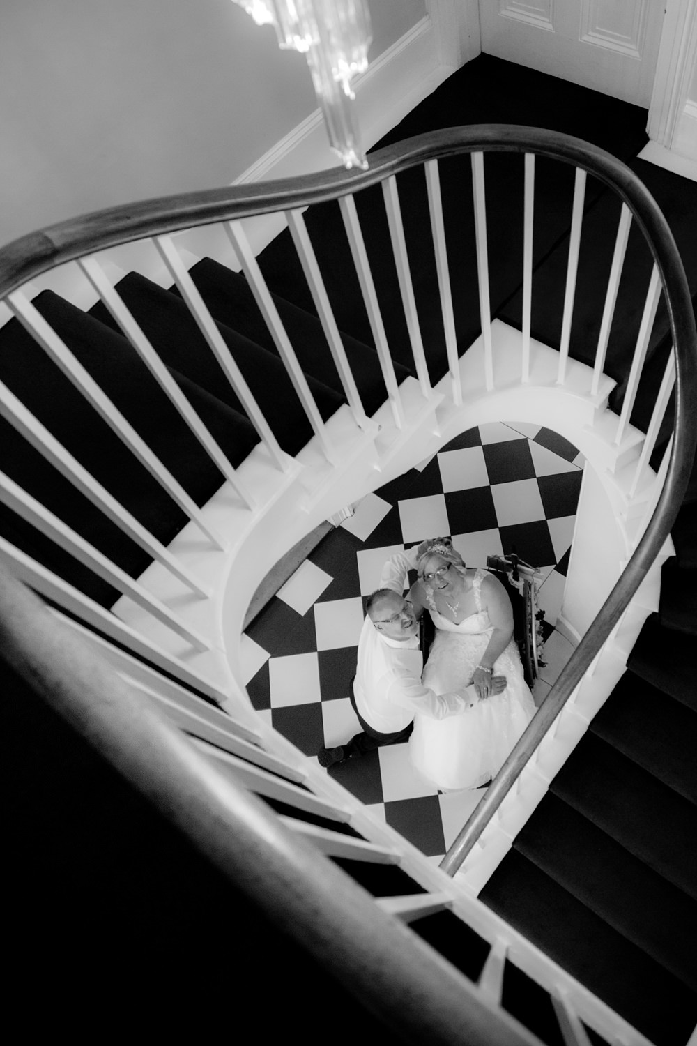 Bride and groom with heart staircase